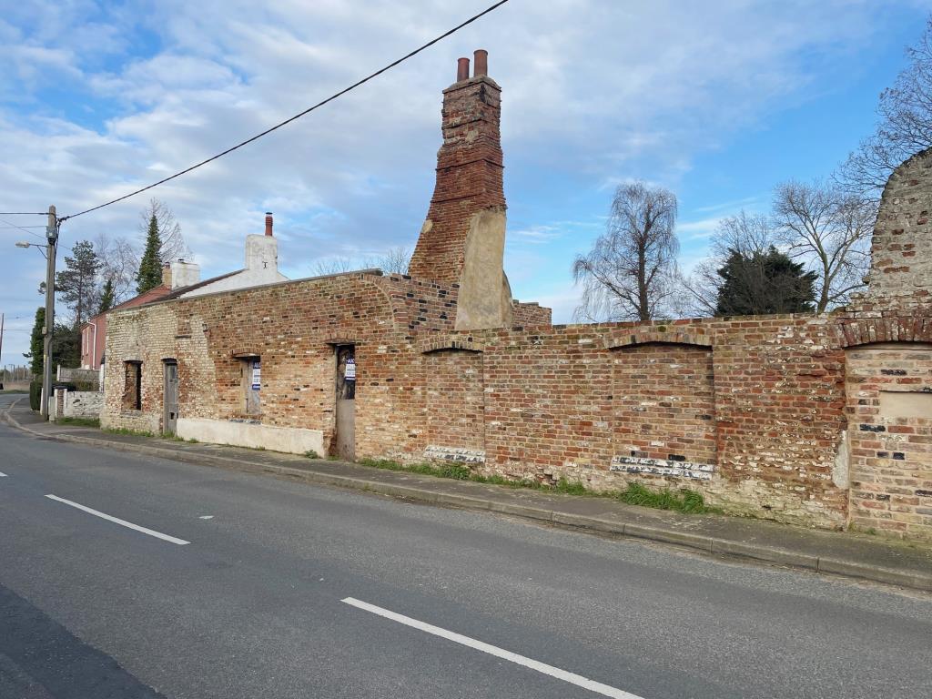 Lot: 101 - COTTAGE RENOVATION PROJECT WITH PLANNING IN VILLAGE LOCATION - Street view of the cottage renovation project in Fenland village
